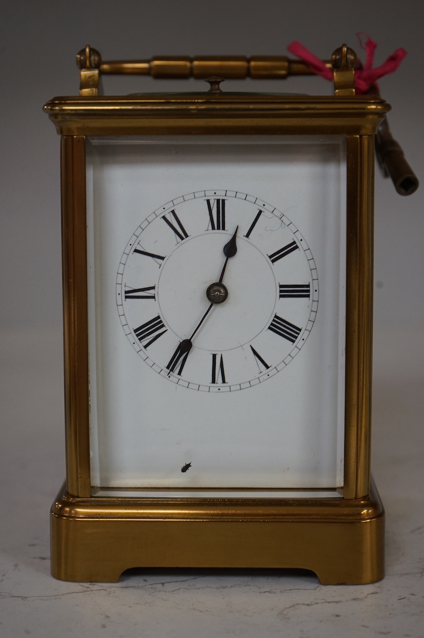 An early 20th century lacquered brass repeating carriage clock, 15cm, with key. Condition - externally good, not tested